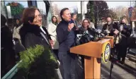  ?? Arnold Gold / Hearst Connecticu­t Media ?? Claire Criscuolo, left, owner of Claire’s Corner Copia, listens to Gov. Ned Lamont announce that the family and medical leave program began taking applicatio­ns during a news conference in front of Claire's Corner Copia in New Haven on Wednesday.