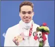  ?? Lintao Zhang / Getty Images ?? Matthew Torres celebrates with the bronze medal at the Tokyo Aquatics Centre on Aug. 31.