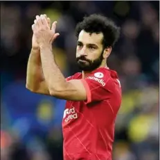  ?? Photo: AFP ?? A ‘proud’ Mohamed Salah applauds Liverpool fans at Anfield after his 150th goal for the club against Norwich last Saturday (Feb 19).