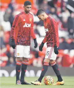  ??  ?? Manchester United’s Marcus Rashford and Jesse Lingard warm up before the Premier League match against Arsenal at the Old Trafford. — Reuters photo