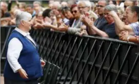  ?? FRANCOIS MORI — THE ASSOCIATED PRESS ?? French nun Sister Danielle, left, is greeted by residents during a gathering in a town park for a solemn homage to the Rev. Jacques Hamel in Saint-Etienne-du-Rouvray, Normandy, France, Thursday.