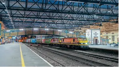  ?? ?? A disappeari­ng scene – for now. On September 10, Freightlin­er’s 90010 and 90047 pass through Carlisle station with a Coatbridge to Crewe container working. Tom Mcatee