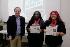  ?? (Matt Hutcheson/News-Times) ?? Arkansas Speaker of the House Matthew Shepherd presented awards at National History Day Saturday, including to group exhibit first place winners Zy’Rhihanna Chambers and Isabella Rivas.