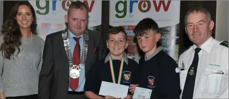  ??  ?? Special Award winners, Ardee Monastery NS represente­d by teacher Sheila McKeown and pupils Nathan Carroll and Eamonn Finlay receive their award from Cllr. Conor Keelan and Litter Warden Martin Reilly at the Louth County Council’s GROW awards