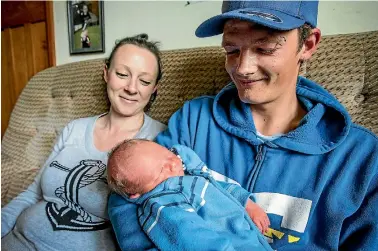  ?? PHOTOS:ANDY JACKSON/FARFAX NZ ?? Proud parents Jayme and Harley Smith with their son Kado Shakur Smith who was born in the couple’s Holden.