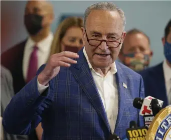  ?? Ap ?? CONGRESS OK NEEDED: New York Sen. Chuck Schumer speaks during a news conference in New York, June 28. Secretary of Transporta­tion Pete Buttigieg toured the century-old rail tunnel connecting New York and New Jersey as a long-delayed project to build a new tunnel gains steam. Below, passengers walk near an Amtrak Acela train stopped at Union Station in Washington, D.C., on Feb. 3.