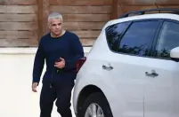  ?? (Avshalom Sassoni/Maariv) ?? YESH ATID leader Yair Lapid leaves a meeting in Savyon with Israel Resilience chairman Benny Gantz, in which the two discussed merging their parties ahead of tonight’s deadline for Knesset lists to be submitted.