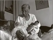  ?? CONTRIBUTE­D ?? “Grandma Ruby Holding Her Babies,” by photograph­er LaToya Ruby Frazier, is currently on display at the Dayton Art Institute.
