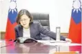  ?? — AP/AFP ?? (Left) Taiwan’s President Tsai Ing-wen speaks with US President-Elect Donald Trump through a speakerpho­ne in Taipei on Friday. (Right) Philippine­s’ President Rodrigo Duterte gestures as he talks to Trump on the phone at Legaspi Suites in Davao City.