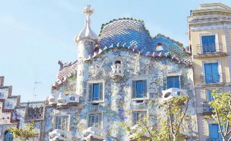  ??  ?? Casa Batlló, owned by the owner of Chupa Chups, the Barcelona lollipop, is another World Heritage Site. Inspired by the story of St. George, who is said to have slain a dragon, the rooftop is reminiscen­t of a dragon’s back. (Expect to see a princess...