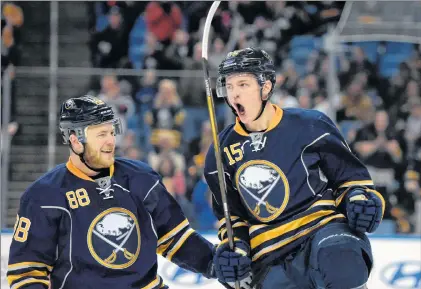  ?? AP PHOTO ?? In this February 2016 photo, Buffalo Sabres’ Jack Eichel (right) celebrates with Jamie Mcginn after Eichel scored during the first period of an NHL game against the Colorado Avalanche in Buffalo, N.Y.