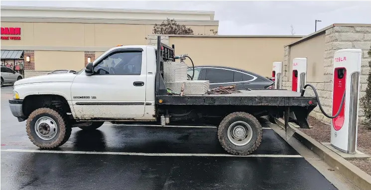  ?? — FRECKLETAN/REDDIT ?? In another example of low-tech but effective revenge, owners of large pickup trucks have started simply blocking charging stations so EVs can’t charge up.