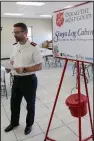  ?? (Arkansas Democrat-Gazette/ Dale Ellis) ?? Maj. Bill Mockabee of the Salvation Army in Central Arkansas provides orientatio­n for bell ringers Wednesday at the Salvation Army Central Command center on Markham Street in Little Rock.