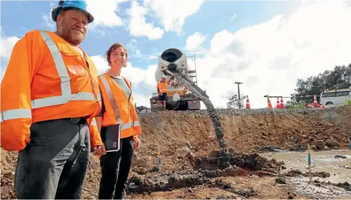  ?? ?? GHK Piling foreman Darryl Nisbet and Northland Regional Council rivers project manager Meg Tyler at the site of the new bridge as concrete fill is being poured into pile holes to contain loose rock. The area will eventually be drilled through and piled for a pier that will form the middle support sections for the bridge.