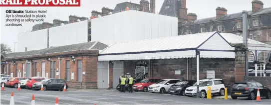  ??  ?? Off limits Station Hotel Ayr is shrouded in plastic sheeting as safety work continues