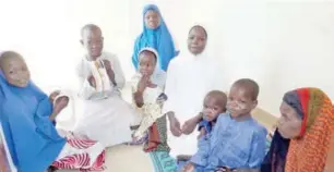  ?? Clement Adeyi, Abuja & Olatunji Omirin, Maiduguri ?? Hajiya Zara Lawan and her grandchild­ren sitting at the passage of their house