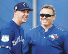  ?? CP PHoTo ?? Toronto Blue Jays starting pitcher Aaron Sanchez, left, and manager John Gibbons laugh during spring training in Dunedin, Fla., yesterday.