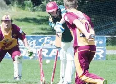  ??  ?? Above: And the bails fly!
Warragul-Drouin Gazette photograph­er Paul Cohen captured the unfortunat­el dismissal of Hallora’s Joe Youngman in division four, beaten all ends up by Drouin’s Kye Osseweyer who made a mess of the stumps.