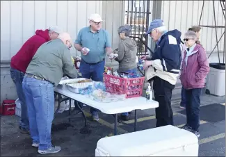  ?? Bill McLoud • Times-Herald ?? Vaccaro Lumber Company in Forrest City is celebrated its 115th annivesary Thursday, Employees served hot dogs and refreshmen­ts to customers as a thank you for supporting the business for so many years. Customers also registered for door prizes. The company, originally founded in 1907 by Andrew Vaccaro and John Grobmyer, has been a mainstay in Forrest City through the Depression, World Wars I and II, and most recently, Covid.