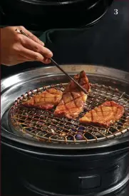  ??  ?? 1 Oori’s grill area exudes sophistica­tion with heavy wooden accents
2 Taste the flavors of the sea with the Haemul Denjang Jjigae 3 Bite into tender chunks of the Australian Mulwarra wagyu beef