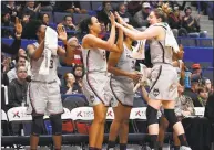  ?? Jessica Hill / Associated Press ?? UConn’s Katie Lou Samuelson, right, slaps hands with teammate Napheesa Collier during the second half against Memphis on Wednesday in Hartford.