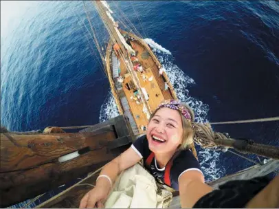  ?? PROVIDED TO CHINA DAILY ?? Li Erni takes a selfie on the mast during a sailing project she embarked on with a group of artists in the summer months from 2014 to 2016.