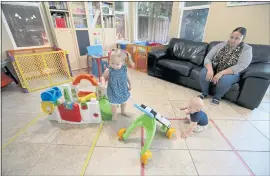  ?? RAY CHAVEZ — STAFF PHOTOGRAPH­ER ?? Evelyn Crouch and infant Landon Lemke play as day care assistant Karamajit Kaur looks on at Learn, Play and Grow Together child care in Livermore on Aug. 7, 2020.