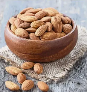  ??  ?? There are some nuts that are high in saturated fats and should be avoided, but there are also some, like almonds, which are quite low in those fats and can be safely eaten as snacks. — TNS