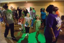  ?? Staff photo by Joshua Boucher ?? ■ Zombies-in-training practice their steps in preparatio­n for a “Thriller” flash mob that will be a highlight of Saturday's Fall Festival in downtown Texarkana.