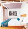  ??  ?? A room at the Retreat includes a comfortabl­e teak-wood king bed fitted with an organic handmade mattress from England.