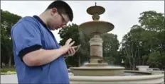  ??  ?? Pokemon passion: Mitchell Garreau, 18, plays Pokeman in Gage Park.