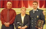  ?? LEAH MCDONALD — ONEIDA DAILY DISPATCH ?? From left, Jerry White, Patty White and Lt. Jeff White pose after Jeff was awarded the Firefighte­rs Crew of the Year Award on Friday, May 6, 2016, at the Kallet Civic Center in Oneida.