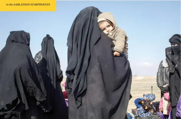  ?? CHRIS MCGRATH / GETTY IMAGES ?? Civilians who have fled fighting in Baghouz, the last village held by ISIL, wait to board trucks on Saturday after being screened by members of the Syrian Democratic Forces.