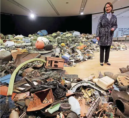  ??  ?? French Minister for ecology, sustainabl­e developmen­t and energy segolene royal looks at waste collected in the sea during a visit to the Plastic Garbage Project exhibit in Marseille, France. — reuters