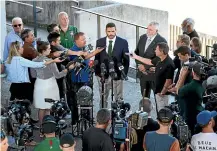  ?? GETTY IMAGES ?? A huge media contingent surrounds Greg Inglis after the NRL star was charged with a drink-driving offence.