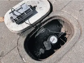  ?? Paul Chinn / The Chronicle ?? The city’s new wireless water meters are installed inside the city’s sidewalks, hidden under a small lid. About half of S.F.’S water meters have been replaced.