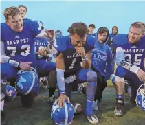  ?? STAFF FILE PHOTO BY JOHN WILCOX ?? FLYING TO FOXBORO: Devaun Ford (center) and Mashpee teammates bask in their state semifinal victory against St. Mary’s, which clinched their spot in Saturday’s Division 7 Super Bowl.