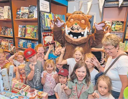  ??  ?? The Gruffalo visits a branch of Waterstone­s. The popular children’s character is from a book by Julia Donaldson, of which 81 copies have not been returned to libraries in Fife.