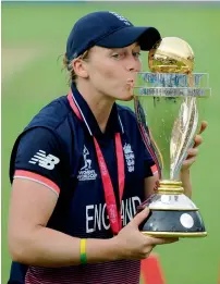  ?? AP ?? Captain Heather Knight kisses the World Cup trophy after England beat India at Lord’s on Sunday. —