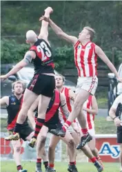  ??  ?? Below right: Trafalgar’s Connor Dastey chases the loose ball during the Fourths match against Yallourn-Yallourn North.