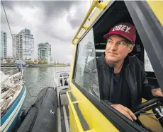  ?? ARLEN REDEKOP ?? Shawn Wilson has been living on his cabin cruiser for the past five years. He believes there is a link between housing unaffordab­ility in the city and the number of people living on their boats.