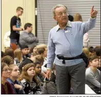  ?? NWA Democrat-Gazette/FLIP PUTTHOFF ?? Pieter Kohnstam talks to students at Fulbright Junior High School in Bentonvill­e on Nov. 14 about his experience­s fleeing Germany during the Holocaust.