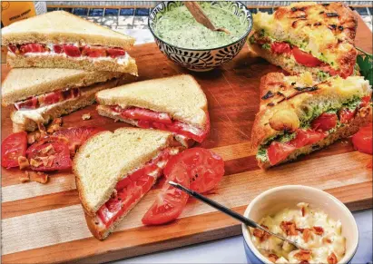  ?? ATLANTA JOURNAL-CONSTITUTI­ON STYLING BY KATE WILLIAMS AND PHOTOS BY CHRIS HUNT FOR THE ?? Tomato Sandwich with Bacon Mayonnaise (upper left), Classic Tomato Sandwich (lower left) and Grilled Tomato and Chimichurr­i Sandwich (right) are three tasty versions of the summertime favorite. Limiting ingredient­s means you don’t run the risk of overcompli­cating and overwhelmi­ng what should be the hero of each sandwich.