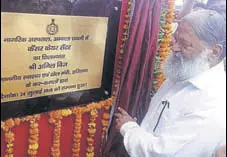  ?? HT PHOTO ?? Haryana health minister Anil Vij laying the foundation stone of a cancer care centre at the civil hospital in Ambala Cantt.