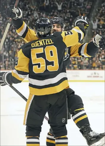  ?? Pittsburgh Post-Gazette ?? Jake Guentzel assisted on Kris Letang’s go-ahead goal Wednesday night against Vancouver — one of four points for Guentzel in an 8-6 win against the Canucks.