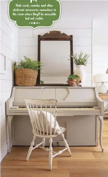  ?? ?? When her son requested a piano, Ashley decided, “We’re going to make it as cute as we can.” She’s painted it several times, but says she only attempts painting the visible areas. The basket on top of the piano hides electronic­s for the television and an extension cord, with a faux plant covering the top.