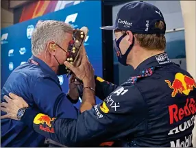  ??  ?? NIFTY AT 50: Birthday boy David Coulthard gets a surprise from Verstappen yesterday