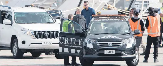  ?? Picture / Brett Phibbs ?? Director of the FBI James Comey (blue shirt) after arriving at Queenstown Airport.