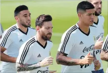  ?? RICARDO MAZALAN THE ASSOCIATED PRESS ?? Marcos Rojo, right, and Lionel Messi jog during a training session of Argentina. At age 31, this may be the best shot Messi has of capturing a World Cup.