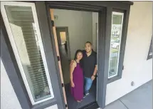  ?? DOUG DURAN — STAFF PHOTOGRAPH­ER ?? Laura and Don Zapata shov their Tracy Hills home in Tracy. The San Francisco natiues vere fed up vith city liuing, and vith the nev-found ability to vork from anyvhere, they moued into a four-bedroom home.